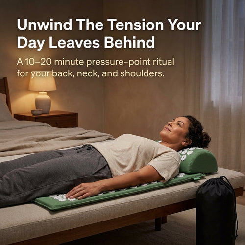 Woman lying on a green acupressure mat and pillow beside a black storage bag